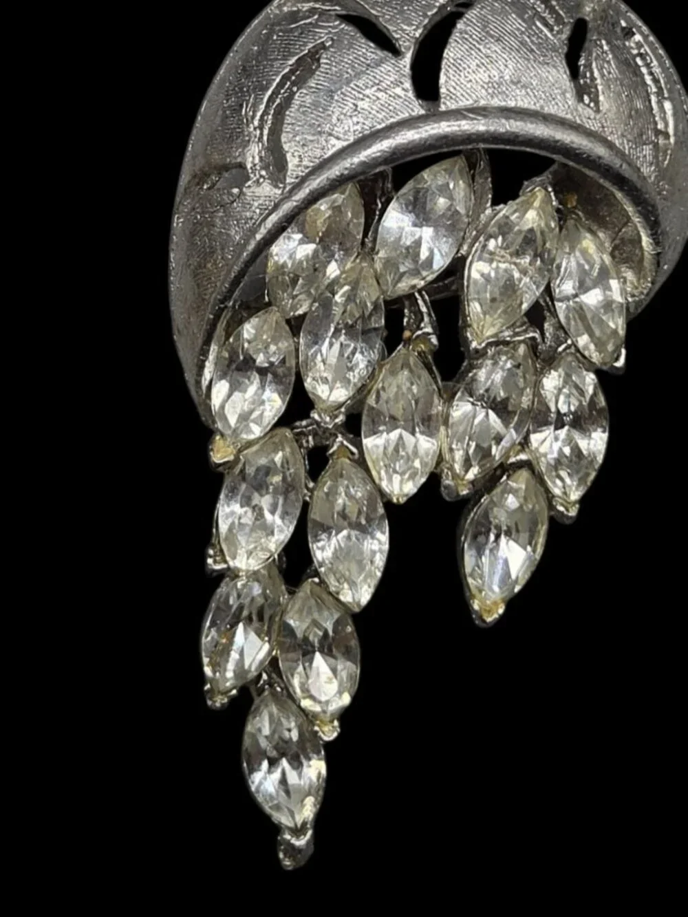 None this brooch